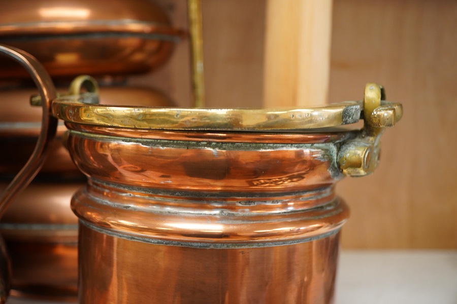 Copper vessels and a brass handled jug and bucket, largest 33cm high